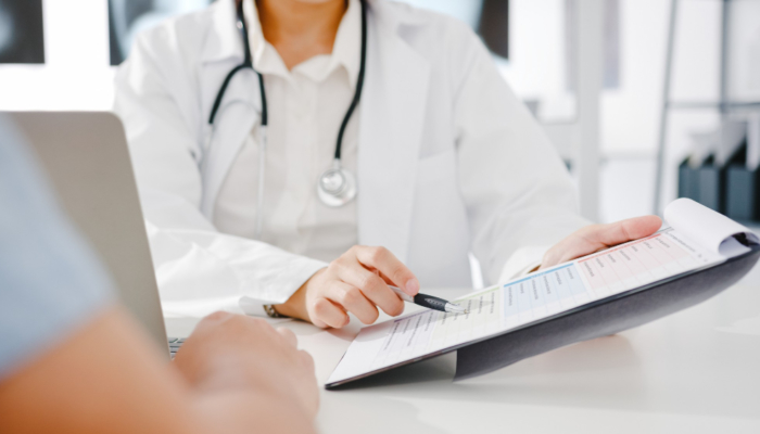 young-asia-female-doctor-white-medical-uniform-using-clipboard-is-delivering-great-news-talk-discuss-results